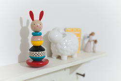 babys-toys-on-shelf, wooden toys rabbit, and a sheep